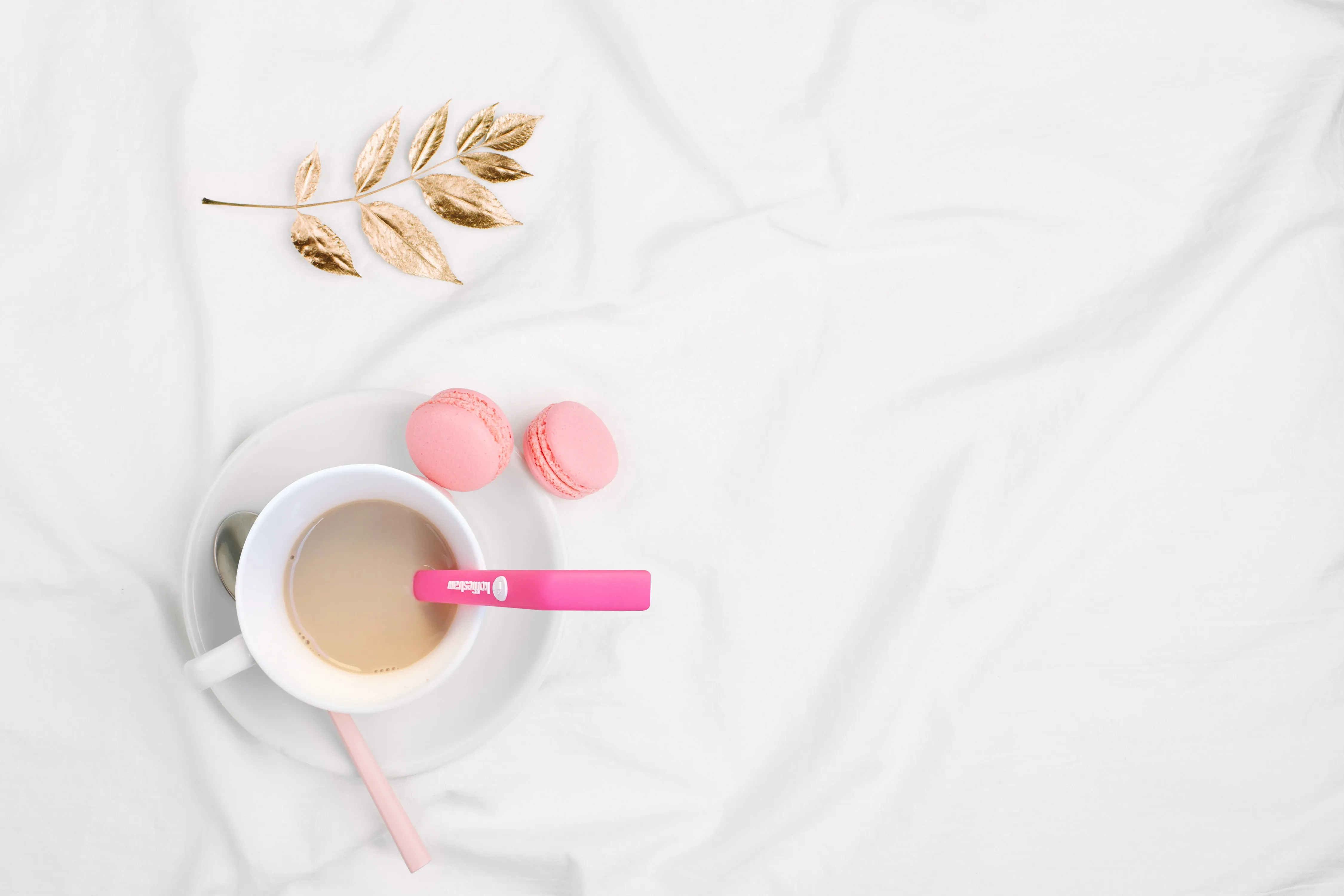 4-Pack of KoffieStraw 10": Pink, Black, Mocha, Surf with stainless steel cleaning brush in a home compostable packaging